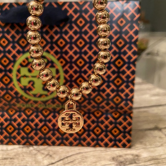 New! Gorgeous beaded, stretchy bracelet with Tory Burch logo charm - Picture 10 of 12